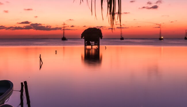 Traveller enjoying the sunset, Caye Caulker, Belize