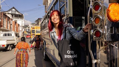 Intrepid traveller looks out as they board a chicken bus in Quetzaltenango in Guatemala