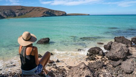 Intrepid traveller relaxing on Balandra Bay Beach, La Paz