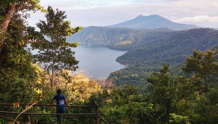 Traveller looks out over the landscape of Mombacho Volcano Natural Reserve