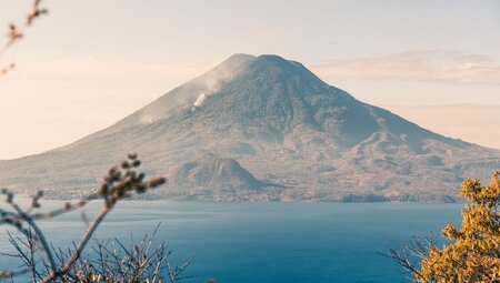Atitlan Volcano lies beyond the expanse of Lake Atitlan in Guatemala