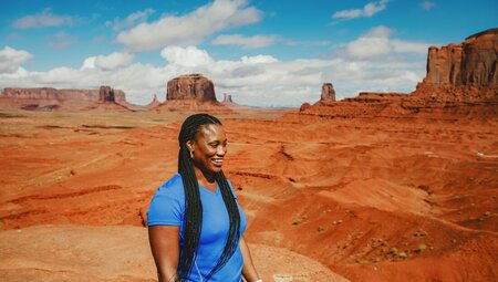Woman in Monument Valley during a Navajo guided tour, Utah, USA