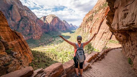 Hiker revelling in views en route to Angel's Landing in Zion National Park, Utah, USA