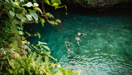 Looking down at To Sea Trench where travellers are swimming, Samoa