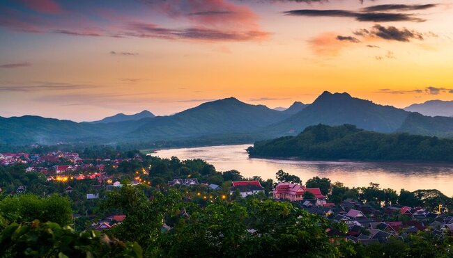 The sun sets behind Mount Phousi over Luang Prabang in Laos
