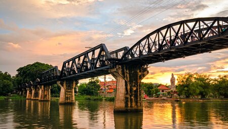 River Kwai Bridge during sunset in Kanchanaburi, Thailand