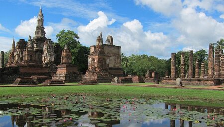 TTPT - Blue skies Sukhothai ruins and lotus pond in Thailand