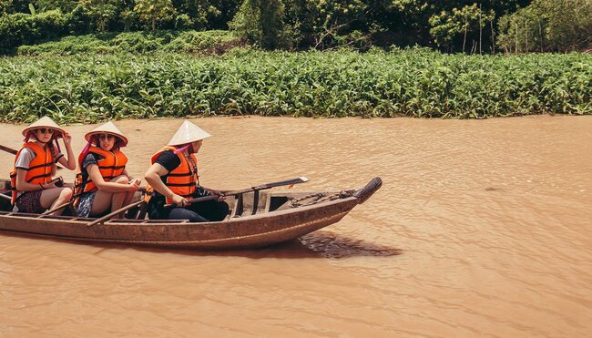 gteac_vietnam_mekong-river_canoe_smiling-pax_banner