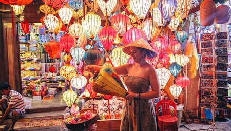 Traveller looks at lantern market in Hoi An