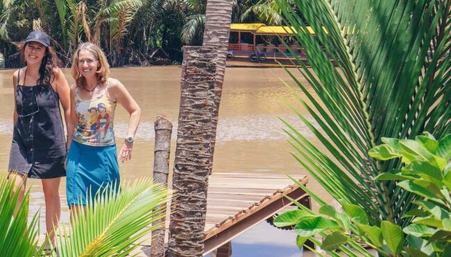 Travellers get ready to board boat on the mekong