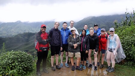 An Intrepid Travel group celebrating after completing a hike in Sapa, Vietnam.