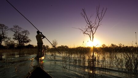 Peregrine Adventures botswana okavango delta river mokoro sunset