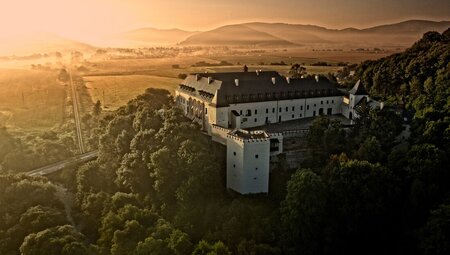 Hotel Grand Viglas perched on a forested hilltop at sunrise overlooking Banksa Stiavnica in Slovakia
