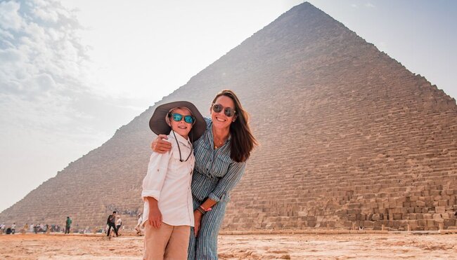 At the base of the Great Pyramids of Giza outside Cairo