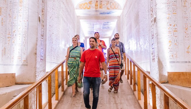 Travellers walking through the temples in Luxor, Egypt