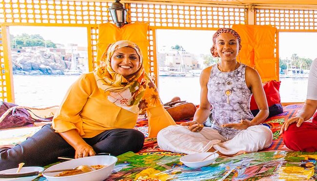 group of travellers enjoying a Felucca lunch on the Nile, Egypt