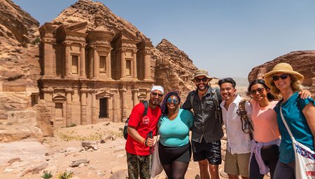 Group and tour leader in front of Petra ruins