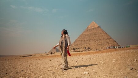 Traveller walking by the Great Pyramids of Giza