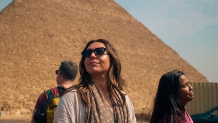 Travellers in front of a Pyramid in Giza, Cairo, Egypt