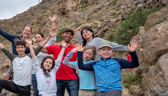Family posing with local leader in the Atlas Mountains region of Morocco