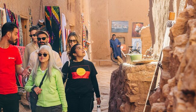 Travellers in the streets of Air Benhaddou, Morocco