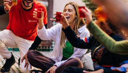Intrepid travellers and leader cheers tea in Marrakech, Morocco