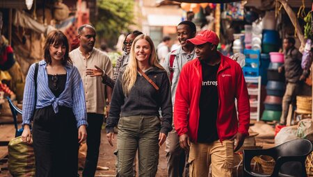 Exploring the Mto wa Mbu market with new friends on an Intrepid tour