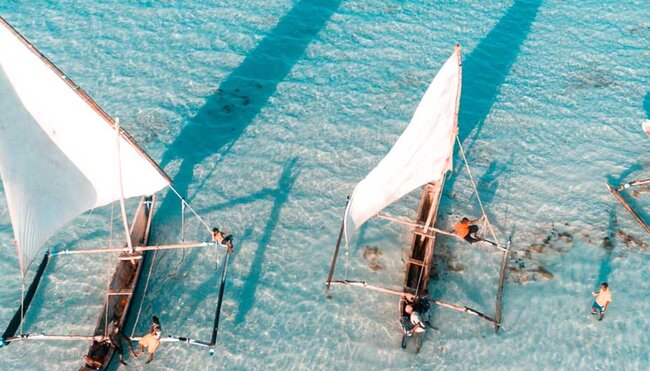Aerial view of fisherman on the clear waters of Zanzibar