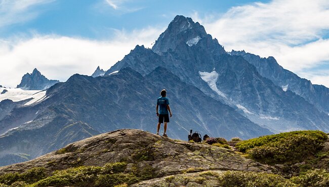 Hiker admiring Mont Blanc mountain range, France