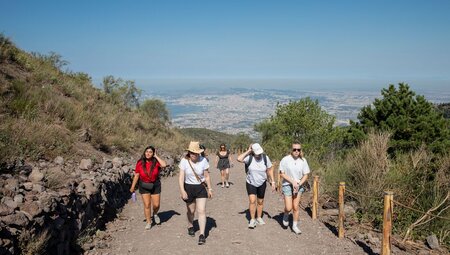 Intrepid travellers and leader hiking Mt Vesuvius near Pompeii, Italy