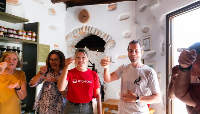 Intrepid group sample fresh olive oil on Naxos island in the Cyclades Greece