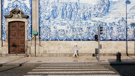Intrepid traveller looks out over the cityscape of Porto in Portugal