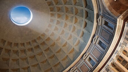 Sunlight beams in through the roof of the Roman Pantheon