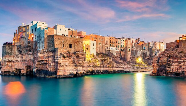 Panoramic evening cityscape of Polignano a Mare town, Puglia region, Italy, Europe.