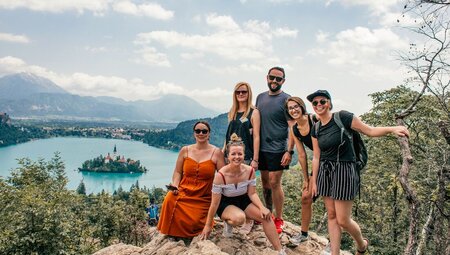 Group of travellers look out over Lake Bled