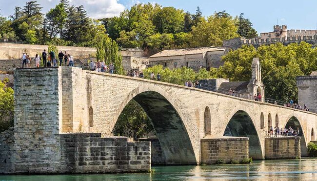 Saint benezet bridge meets canal in Avignon France