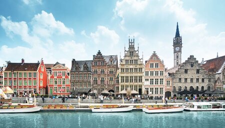 Boats lined up along the river in the old town of Ghent, Belgium