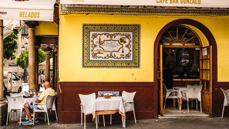 Street and exterior of Cafe Bar Gonzalo in Seville Spain