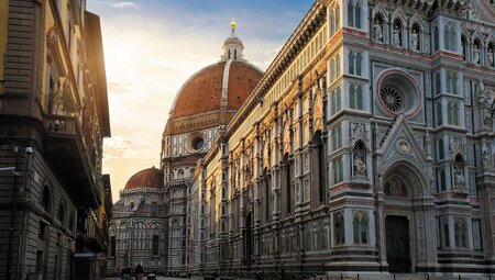 Piazza del Duomo in Florence hit by the sunrise in Italy