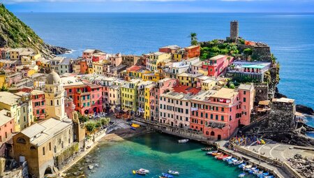 View of the colourful buildings and stunning water of Vernazza Harbour in Cinque Terre, Italy