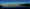 see, in dem sich berge am horizont spiegeln